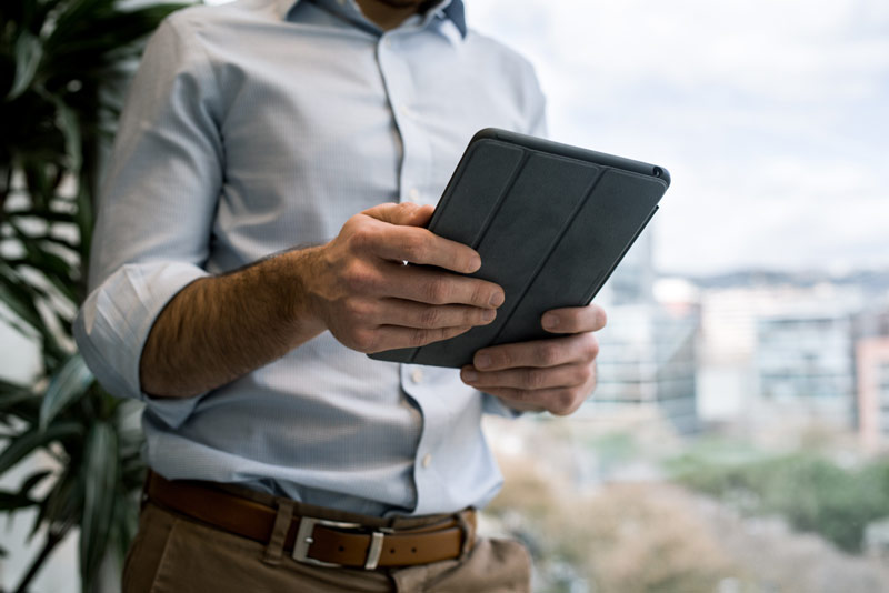 Person holding with iPad app